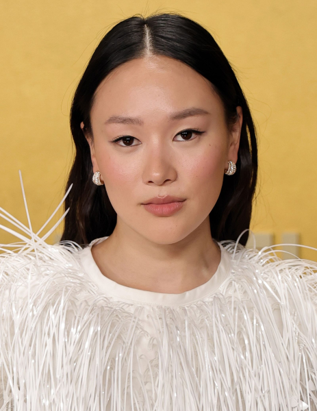 Yerin Ha poses in a white feathery dress